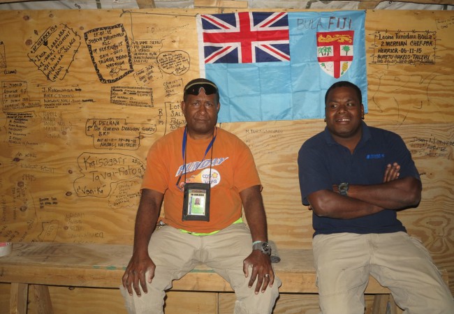 Fijian contractors at the Fijian Club, next to National Air Cargo office at Camp Bastion, where Fijians, Tongans and other Pacific islanders gather for an occasional shell of kava. At right is contractor Luke Tokaduadua. - Ben Bohane, wakaphotos.com