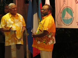 Commodore Bainimarama hands a shell necklace gift to incoming chair Victor Tutugoro at the closing ceremony, Noumea 2013.